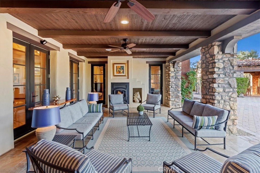 41 Cassis Circle Rancho Mirage, CA 92270 - Photo 46 of 74 a living room with furniture and a large window