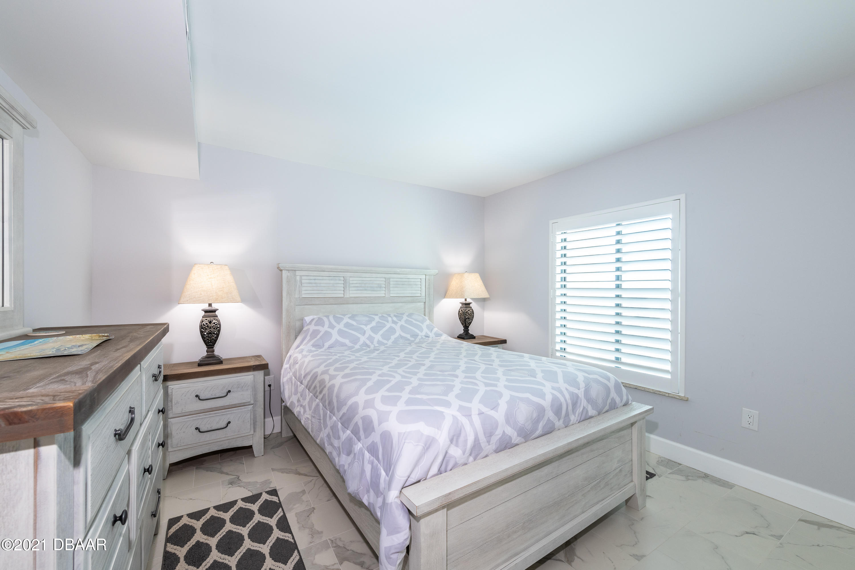 1275 Ocean Shore Boulevard, Unit 307 Ormond Beach, FL 32176 - Photo 13 of 24 a bedroom with a bed and a window