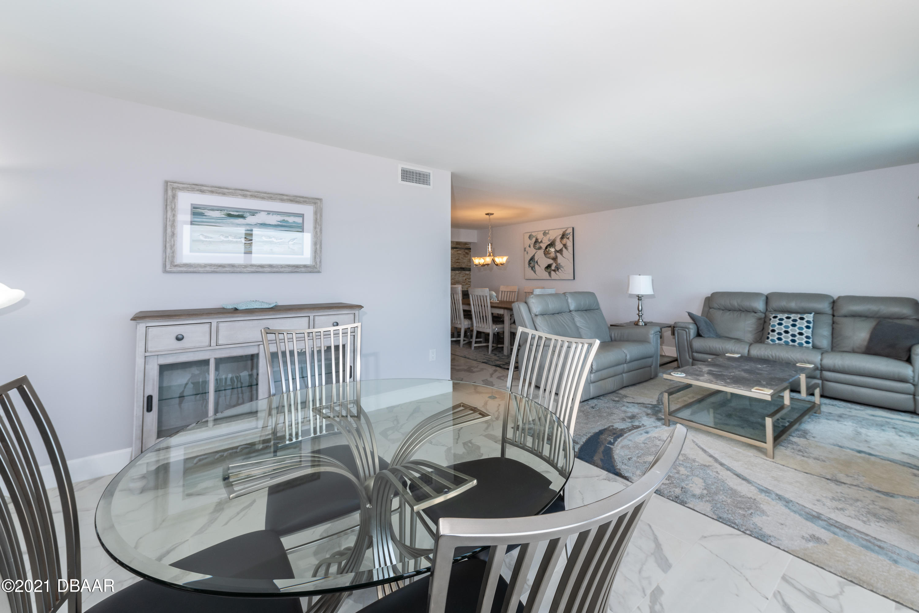 1275 Ocean Shore Boulevard, Unit 307 Ormond Beach, FL 32176 - Photo 19 of 24 a living room with furniture and wooden floor