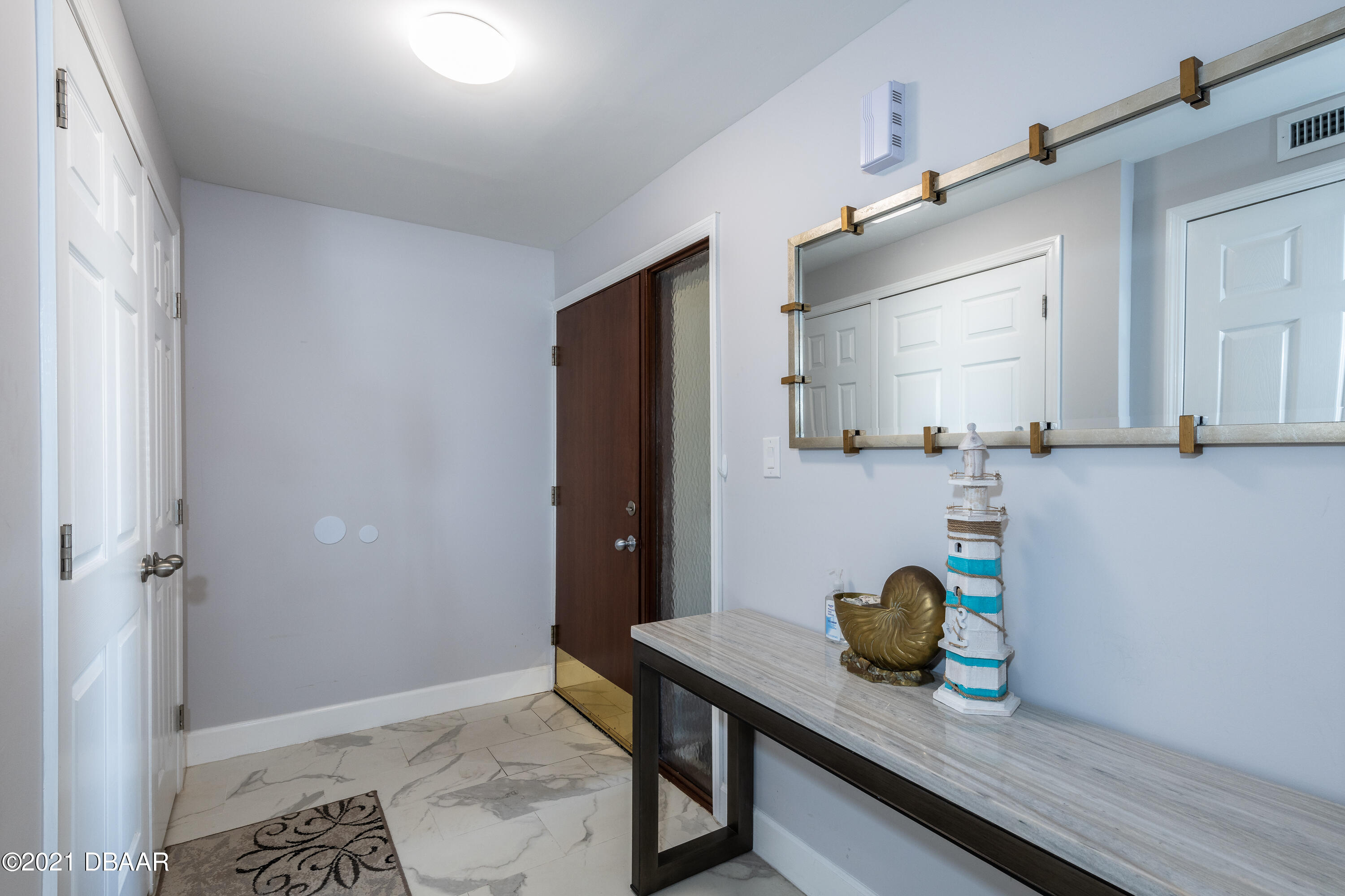 1275 Ocean Shore Boulevard, Unit 307 Ormond Beach, FL 32176 - Photo 2 of 24 a kitchen with a sink and refrigerator