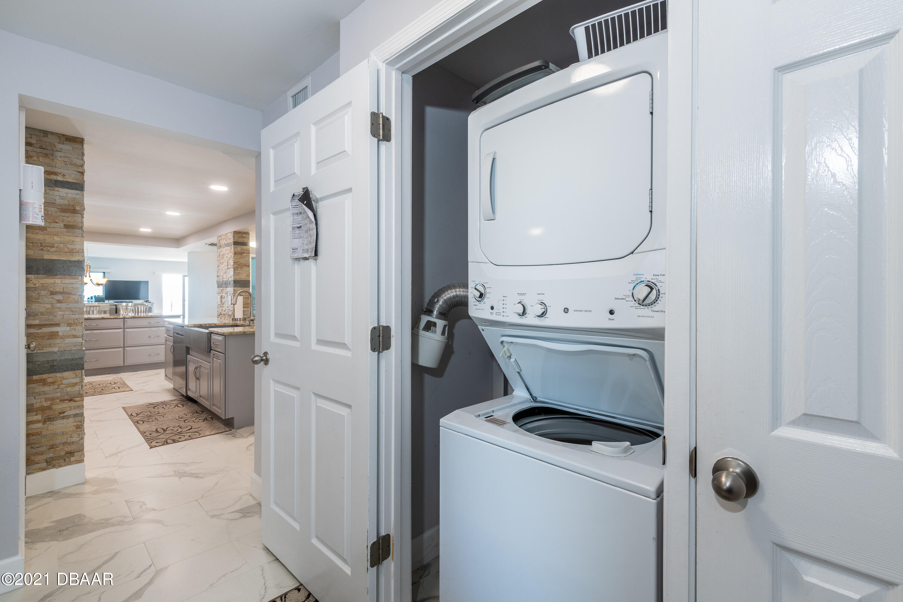1275 Ocean Shore Boulevard, Unit 307 Ormond Beach, FL 32176 - Photo 3 of 24 a view of a storage & utility room with washer and dryer