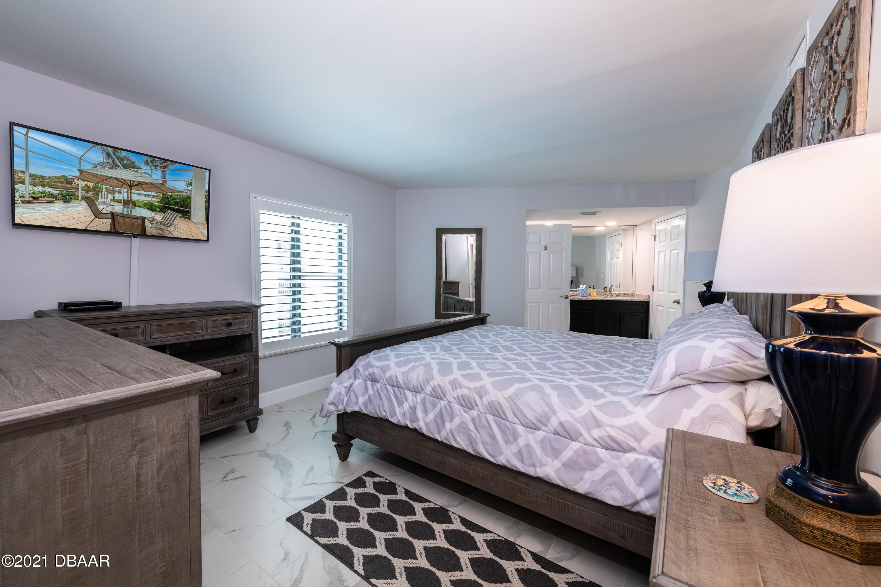 1275 Ocean Shore Boulevard, Unit 307 Ormond Beach, FL 32176 - Photo 9 of 24 a bed room with a bed and a television