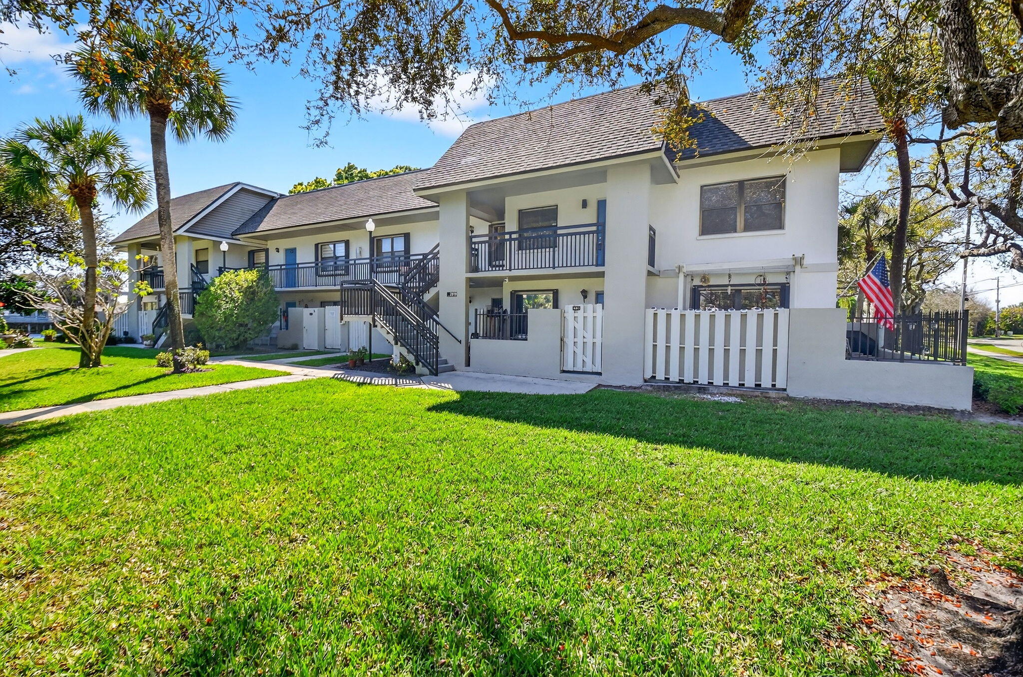 2018 Southwest 29th Court, Unit 642 Delray Beach, FL 33445 - Photo 2 of 23 a view of a house with a yard and a garden