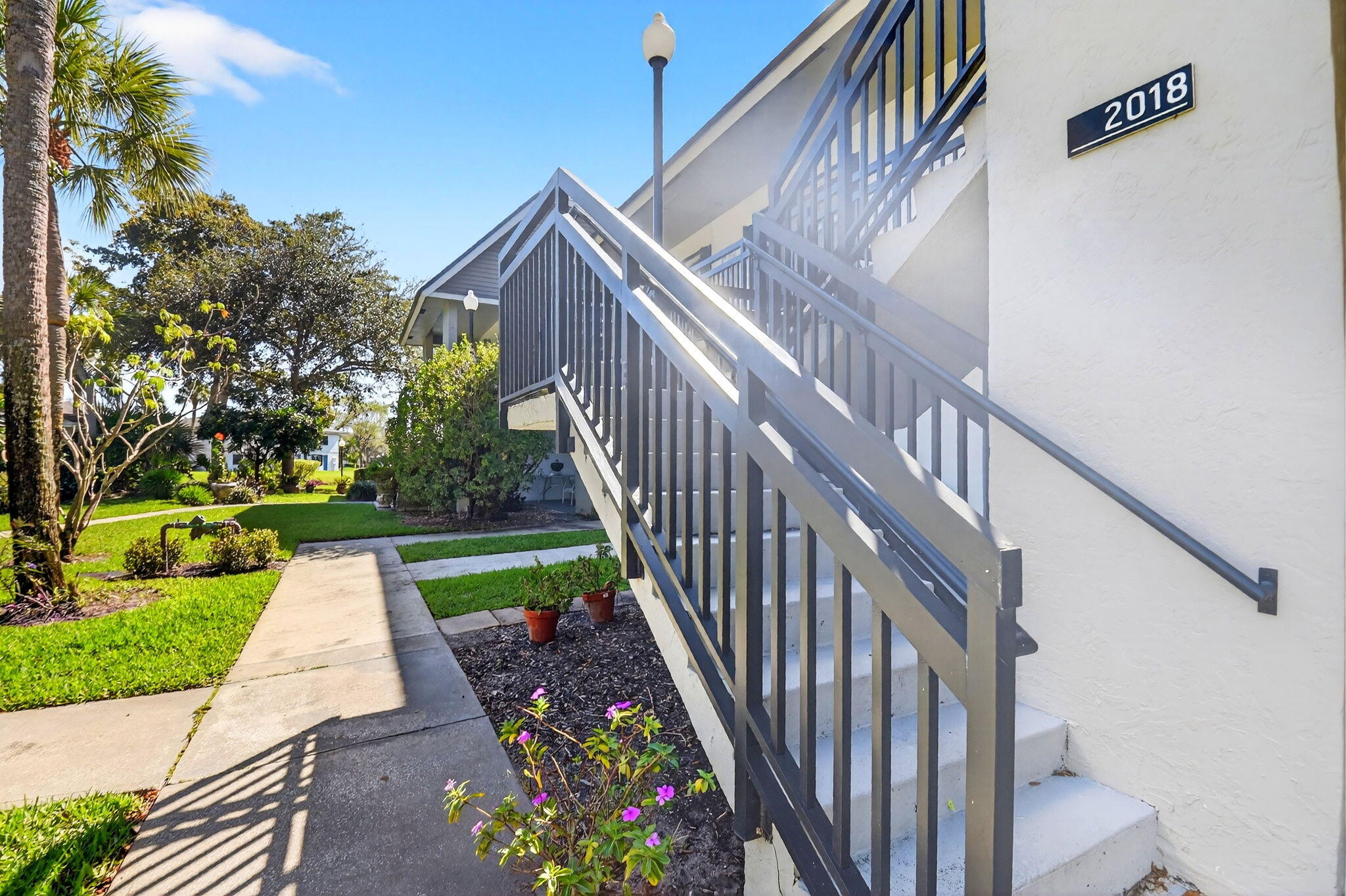 2018 Southwest 29th Court, Unit 642 Delray Beach, FL 33445 - Photo 22 of 23 a view of park with wooden stairs
