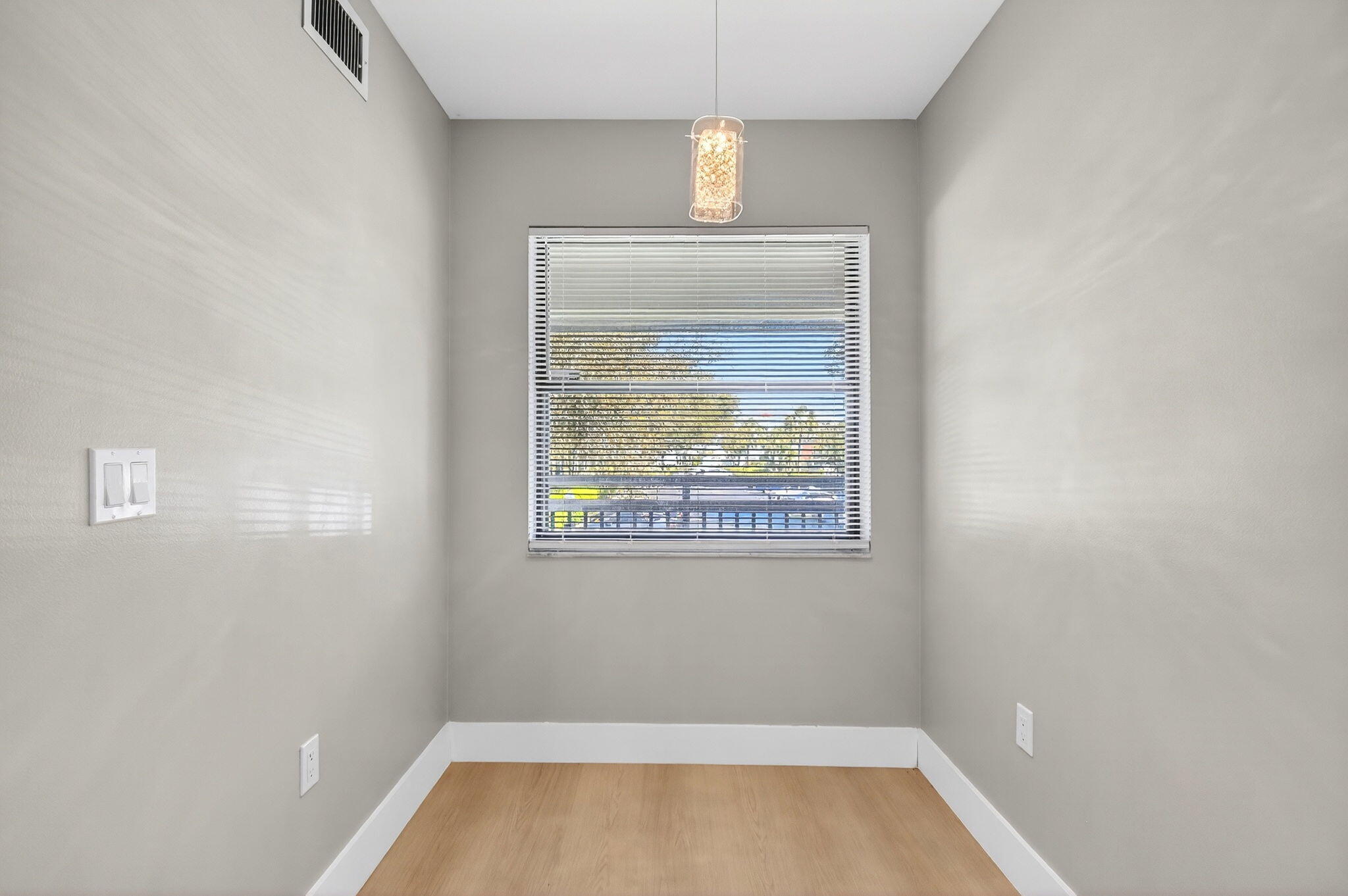 2018 Southwest 29th Court, Unit 642 Delray Beach, FL 33445 - Photo 8 of 23 a view of room with window and hardwood floor