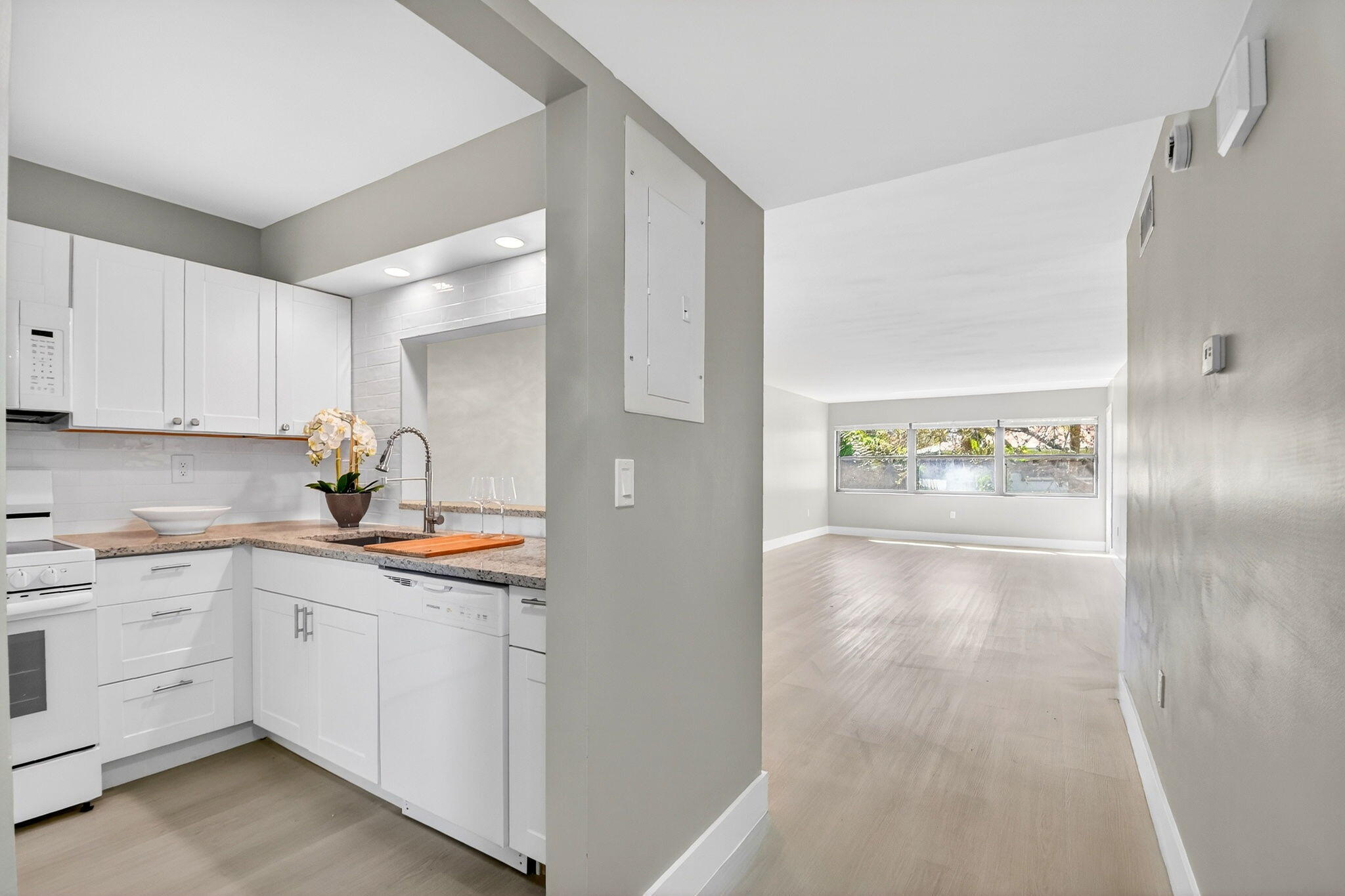 2018 Southwest 29th Court, Unit 642 Delray Beach, FL 33445 - Photo 10 of 23 a view of a hallway to kitchen and utility room