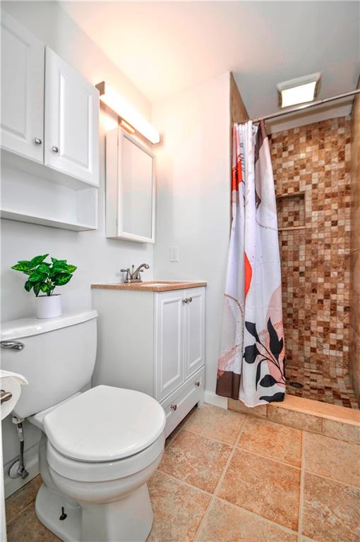 1313 Star Ridge Drive Pittsburgh, PA 15241 - Photo 22 of 36 a bathroom with a sink a toilet and a shower