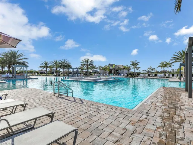 a view of a lake with houses in the back