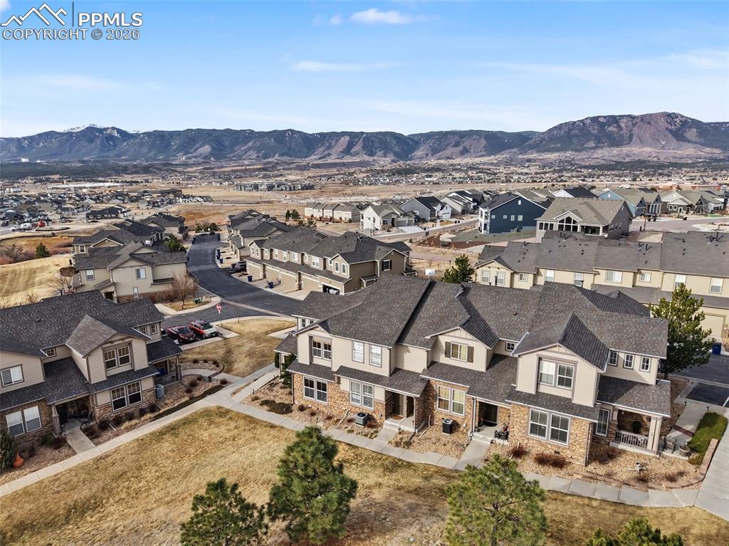 17063 Blue Mist Grove Monument, CO 80132 - Photo 24 of 33 an aerial view of residential houses with outdoor space and trees