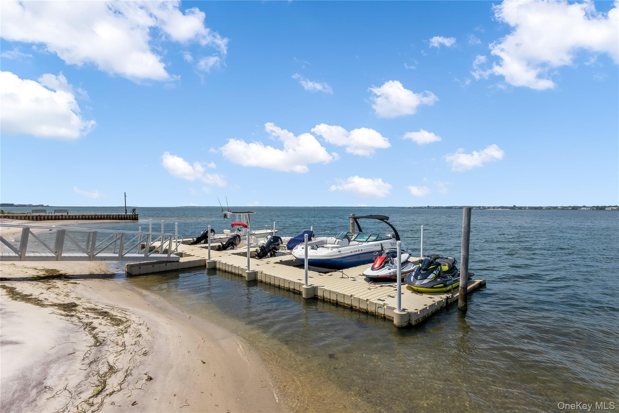 580 Dune Road, Unit 5 Westhampton, NY 11978 - Photo 8 of 22 a view of swimming pool with outdoor seating
