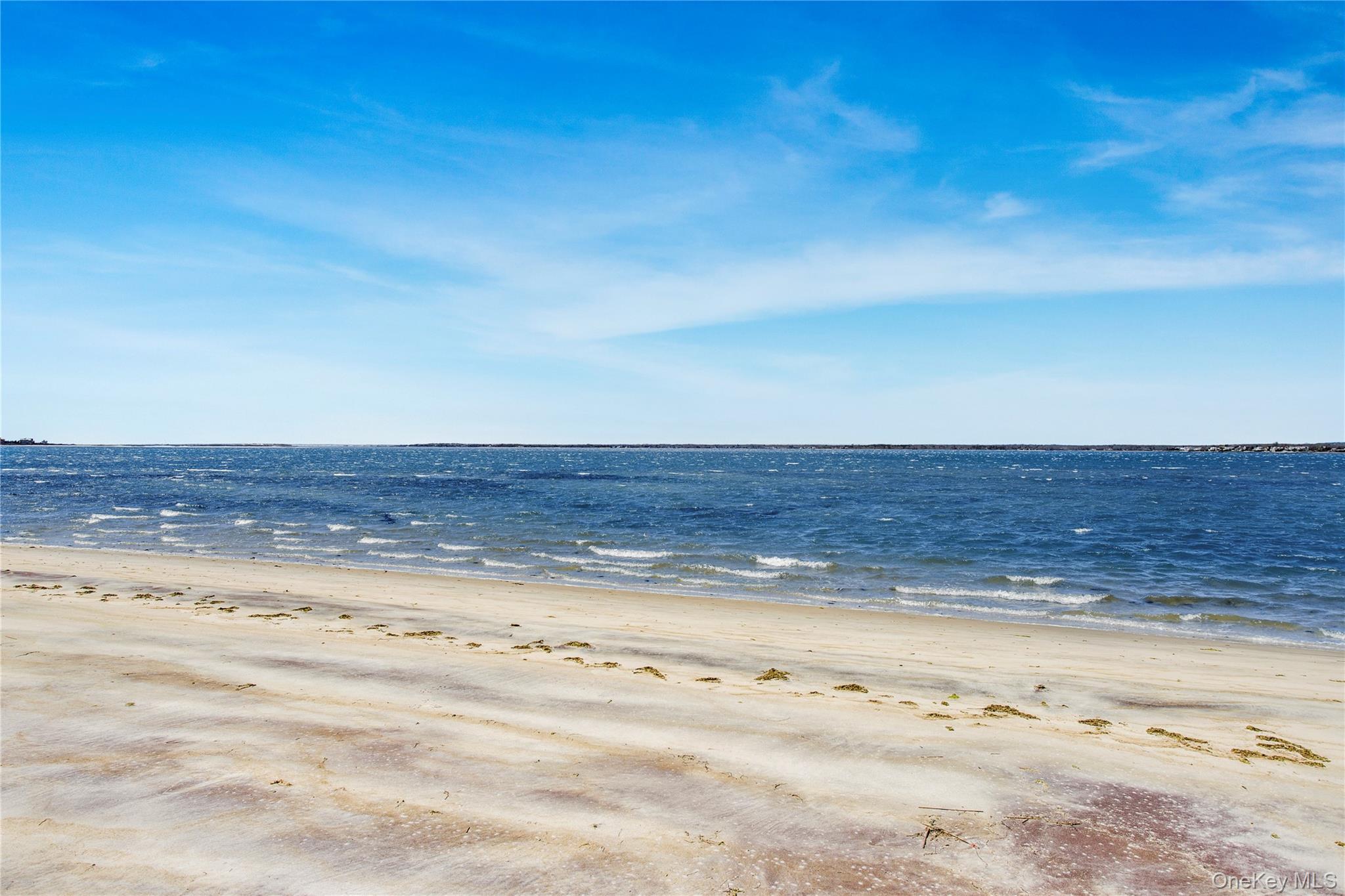 580 Dune Road, Unit 5 Westhampton, NY 11978 - Photo 9 of 22 a view of an ocean beach