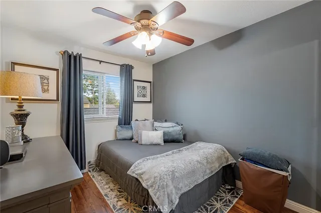 a bedroom with a bed and a desk