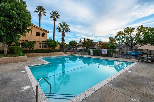 a view of a swimming pool with a lounge chairs