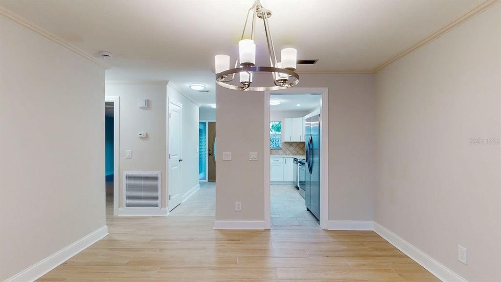 636 Boca Ciega Point Boulevard South St. Petersburg, FL 33708 - Photo 22 of 96 wooden floor in an empty room with a mirror