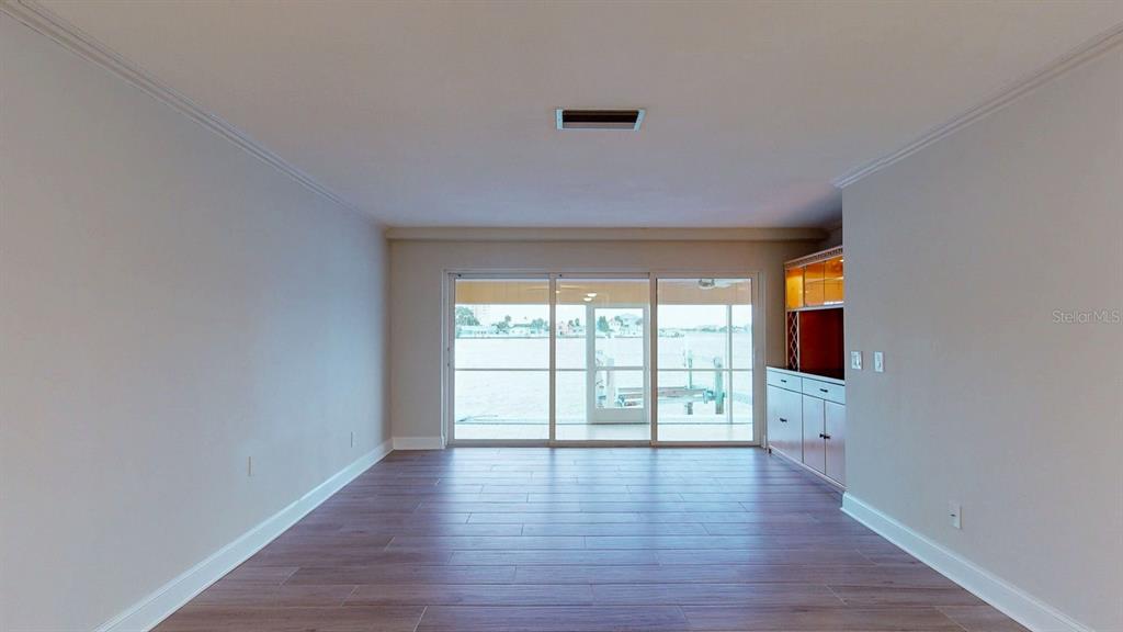 636 Boca Ciega Point Boulevard South St. Petersburg, FL 33708 - Photo 28 of 96 wooden floor in an empty room with a window