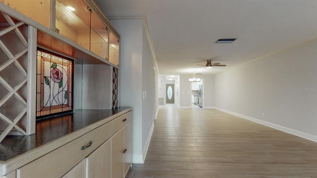 636 Boca Ciega Point Boulevard South St. Petersburg, FL 33708 - Photo 30 of 96 a view of a hallway with wooden floor and staircase