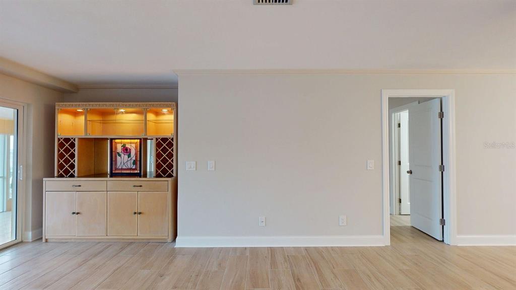 636 Boca Ciega Point Boulevard South St. Petersburg, FL 33708 - Photo 32 of 96 wooden floor in an empty room with a window and wooden floor
