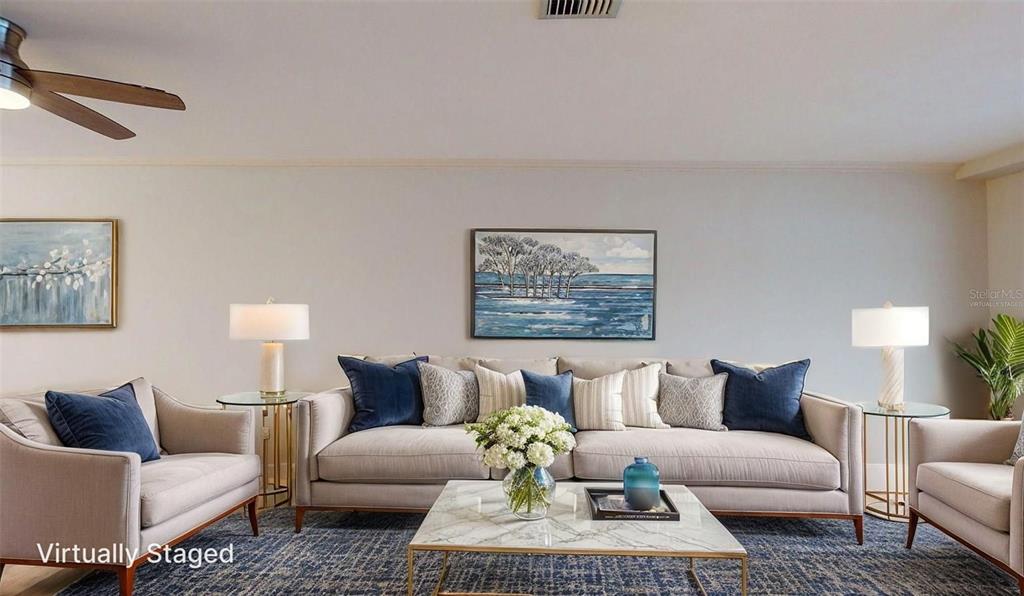 636 Boca Ciega Point Boulevard South St. Petersburg, FL 33708 - Photo 35 of 96 a living room with furniture and a couch