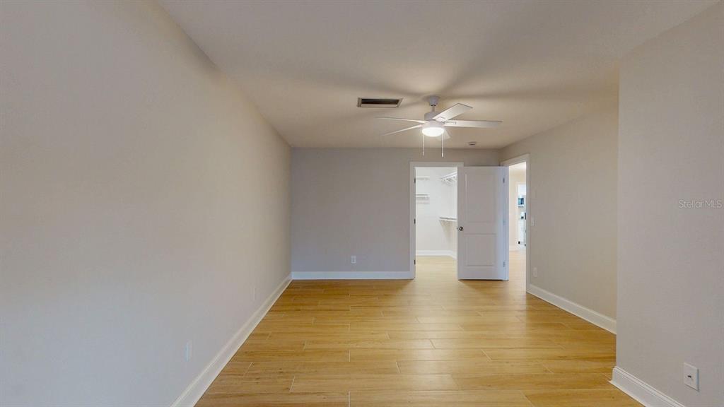 636 Boca Ciega Point Boulevard South St. Petersburg, FL 33708 - Photo 38 of 96 a view of an empty room with wooden floor