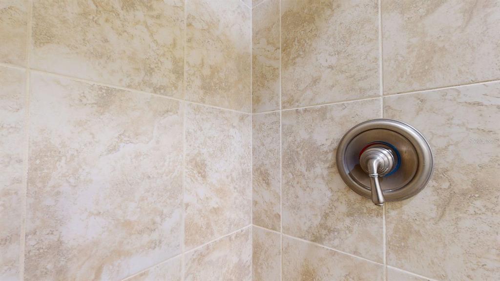 636 Boca Ciega Point Boulevard South St. Petersburg, FL 33708 - Photo 53 of 96 a bathroom with a sink and a mirror