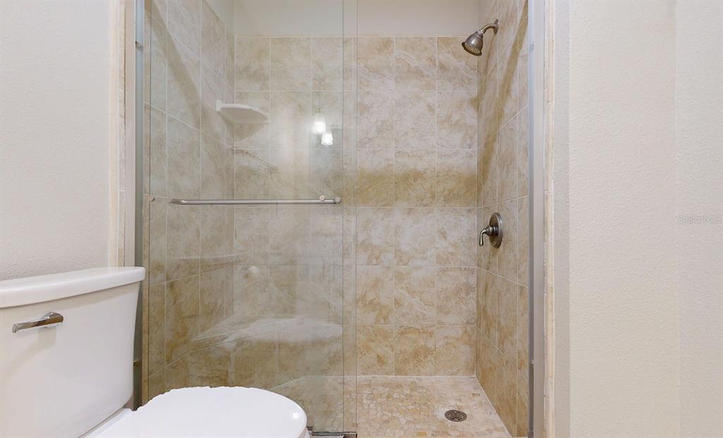 636 Boca Ciega Point Boulevard South St. Petersburg, FL 33708 - Photo 54 of 96 a bathroom with a shower and toilet