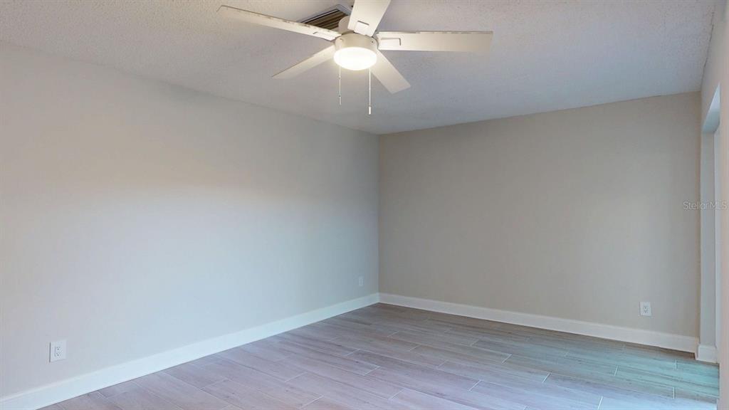 636 Boca Ciega Point Boulevard South St. Petersburg, FL 33708 - Photo 60 of 96 wooden floor in an empty room