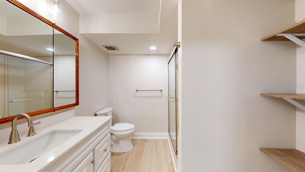 636 Boca Ciega Point Boulevard South St. Petersburg, FL 33708 - Photo 67 of 96 a bathroom with a sink a toilet and shower