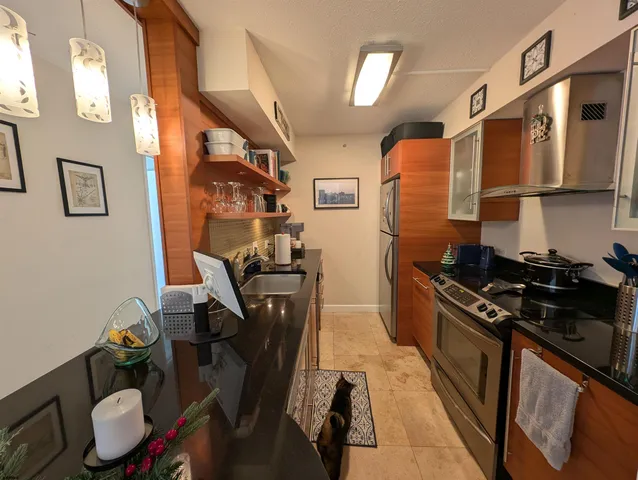 a kitchen with a sink appliances and cabinets