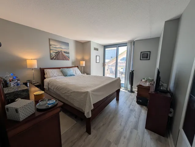 a bathroom with a sink a toilet a mirror and shower curtain