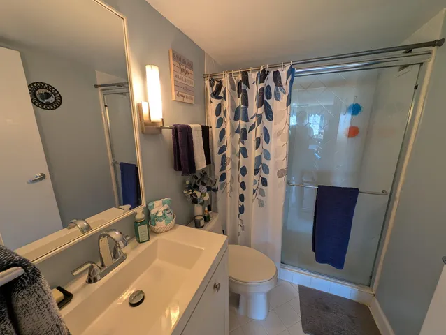 a bed room with a bed and a television