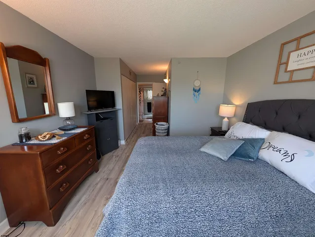 a dining room with furniture and a window