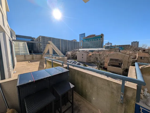 a living room with fireplace furniture and wooden floor