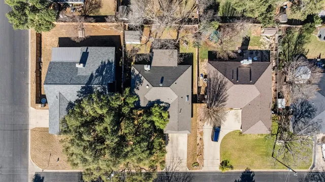 an aerial view of a houses with outdoor space