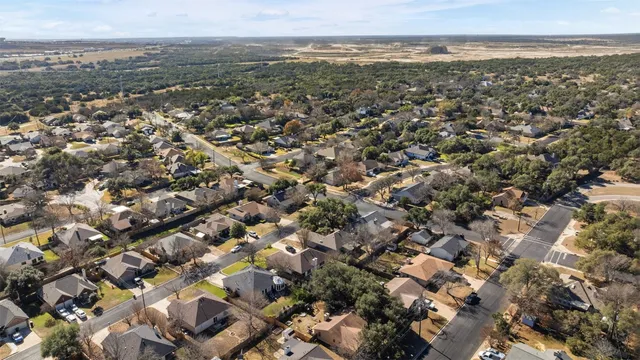 an aerial view of residential building with parking space