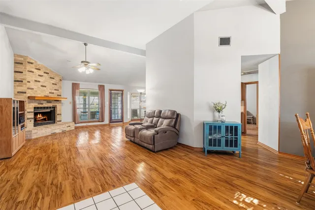 a living room with furniture and a fireplace