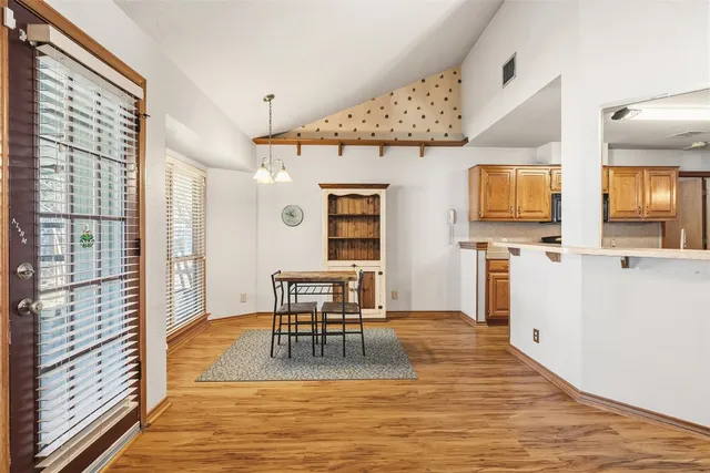 a view of a livingroom with furniture window and wooden floor