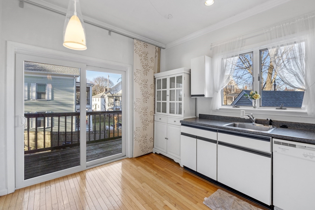 42 Broad Street, Unit 4 Salem, MA 01970 - Photo 12 of 33 a kitchen with stainless steel appliances granite countertop a stove a sink and a granite countertops with cabinets