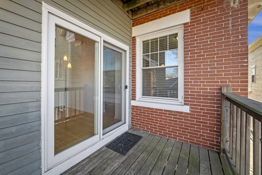 42 Broad Street, Unit 4 Salem, MA 01970 - Photo 14 of 33 a view of a brick house with a large window