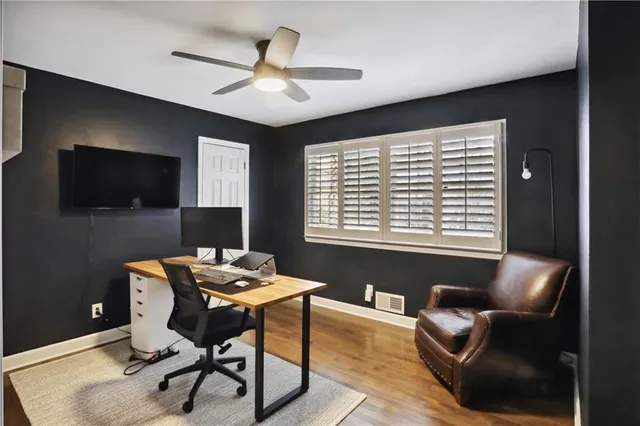 a workspace with furniture and window