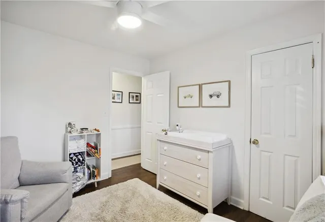 a bathroom with a sink a toilet and shower curtain