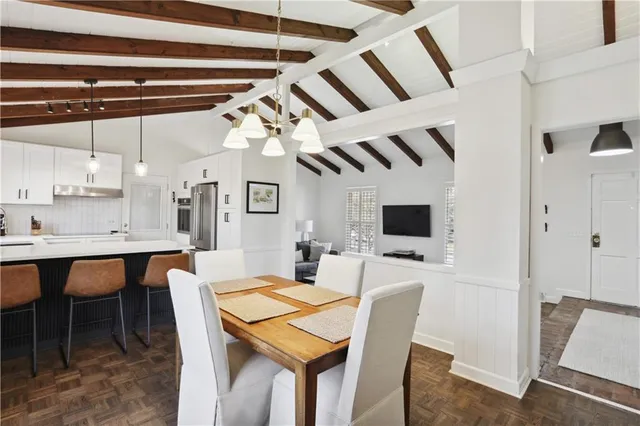 a dining room with furniture and window