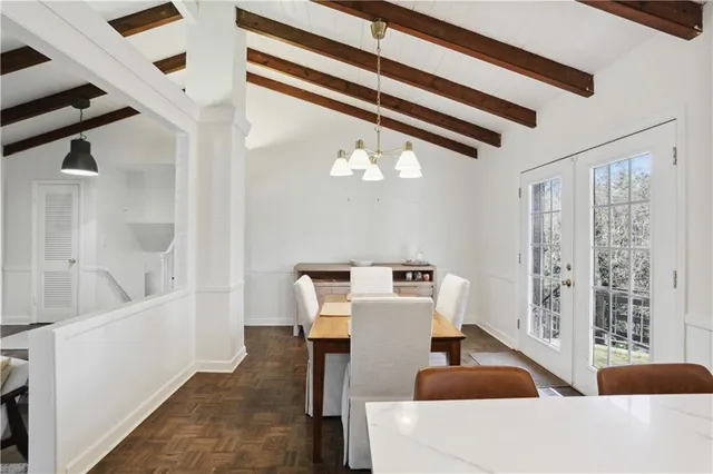 a bathroom with a toilet a sink and a mirror