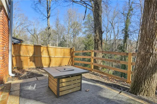 a wooden bench sitting in front of a building
