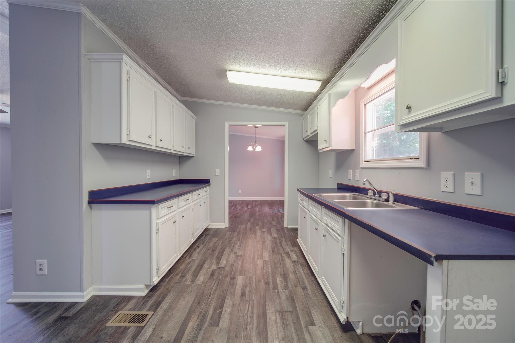 355 Shoreline Road New London, NC 28127 - Photo 12 of 22 a kitchen with stainless steel appliances granite countertop a stove a sink and a refrigerator