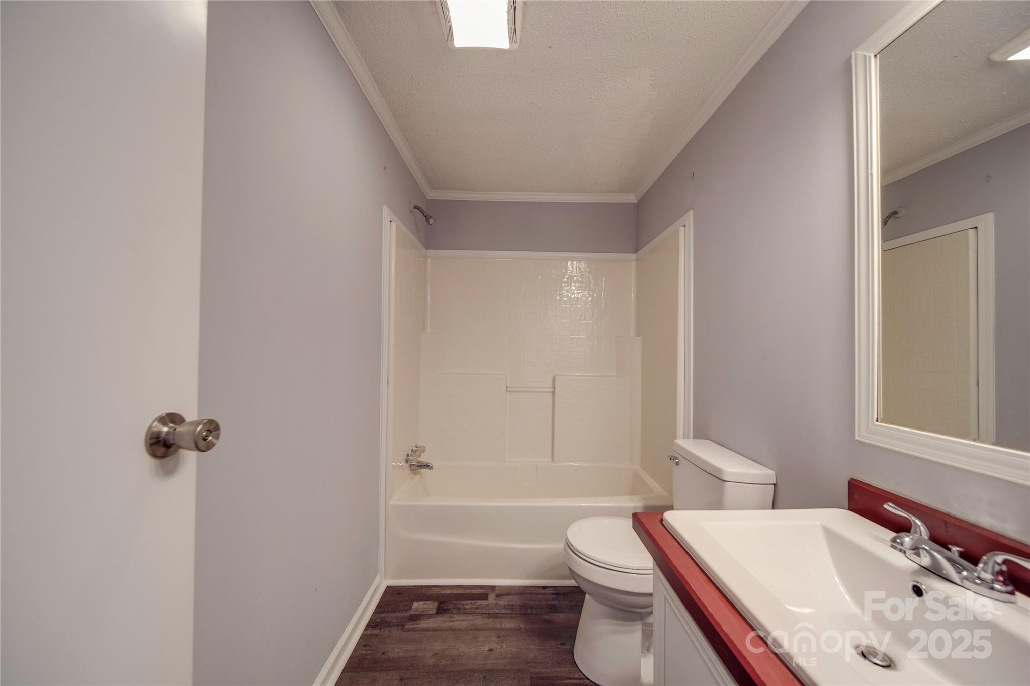 355 Shoreline Road New London, NC 28127 - Photo 18 of 22 a bathroom with a sink toilet and shower
