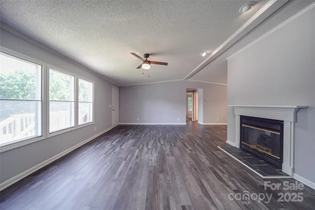 a living room with fireplace furniture and a flat screen tv