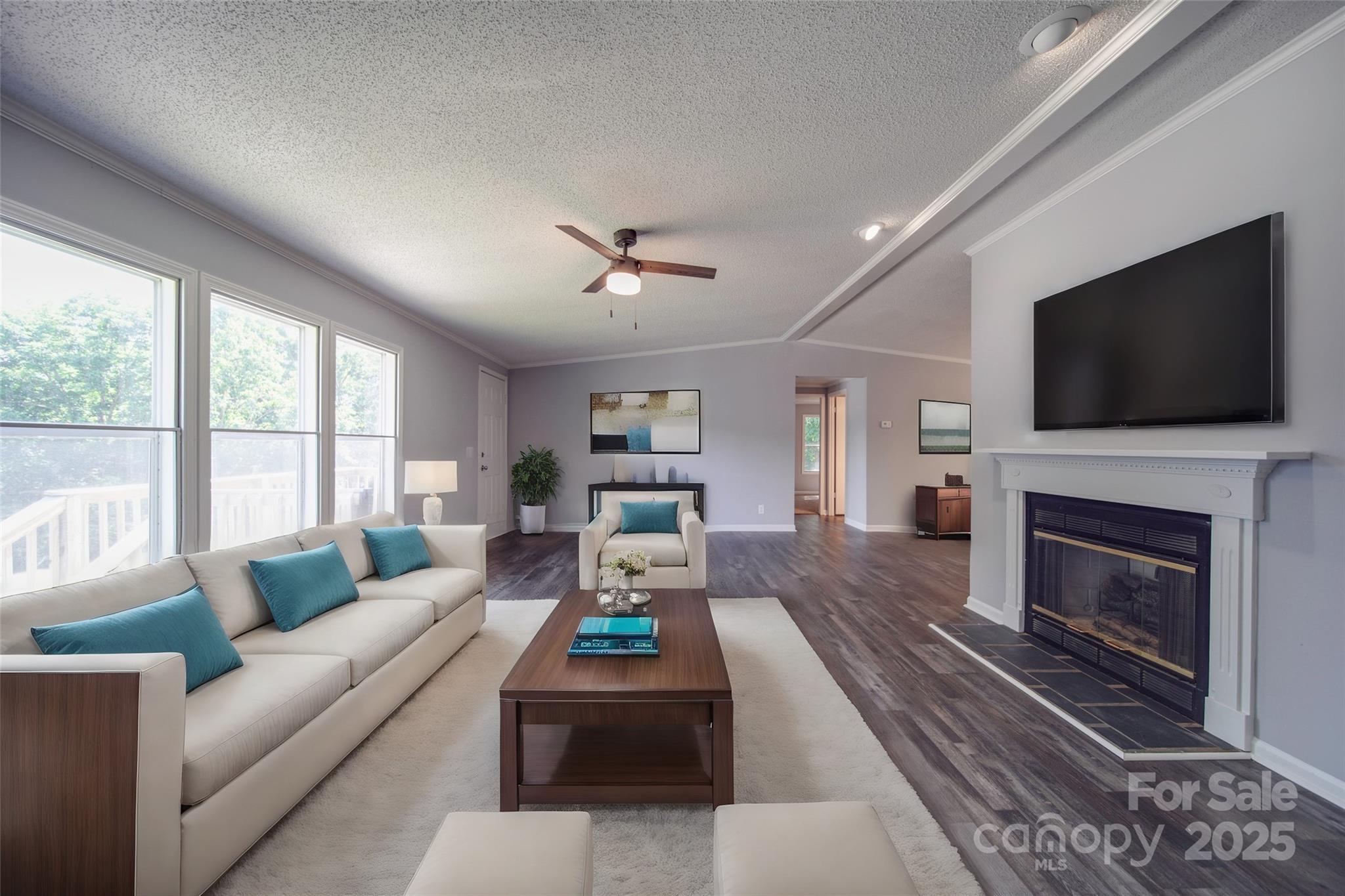 355 Shoreline Road New London, NC 28127 - Photo 7 of 22 a living room with fireplace furniture and a flat screen tv