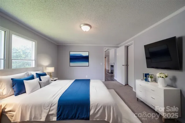 a bathroom with a tub a sink and a large mirror