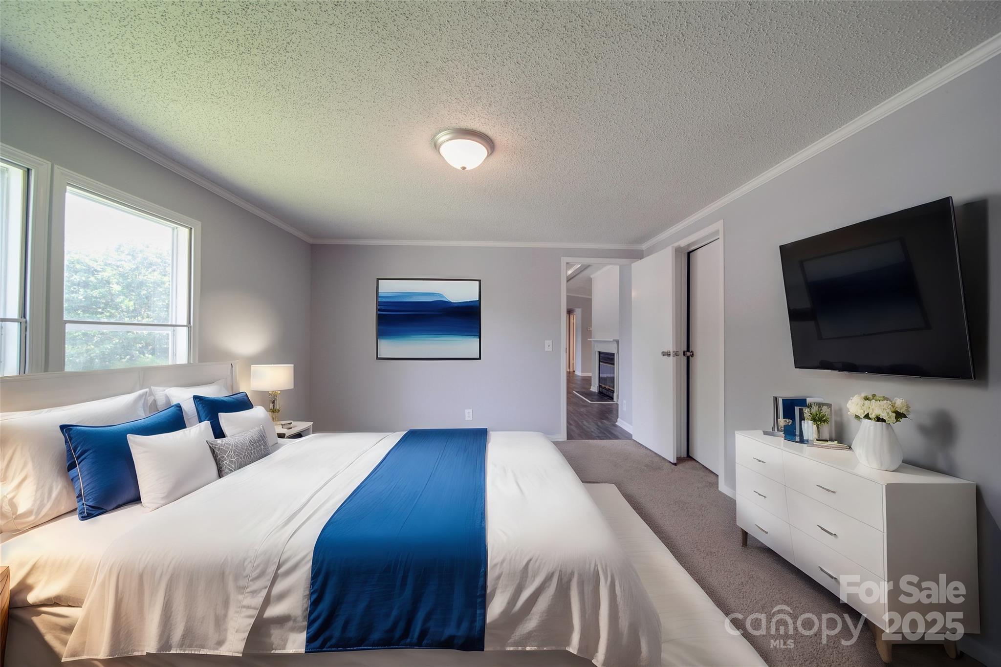 355 Shoreline Road New London, NC 28127 - Photo 10 of 22 a bedroom with a bed and a flat screen tv