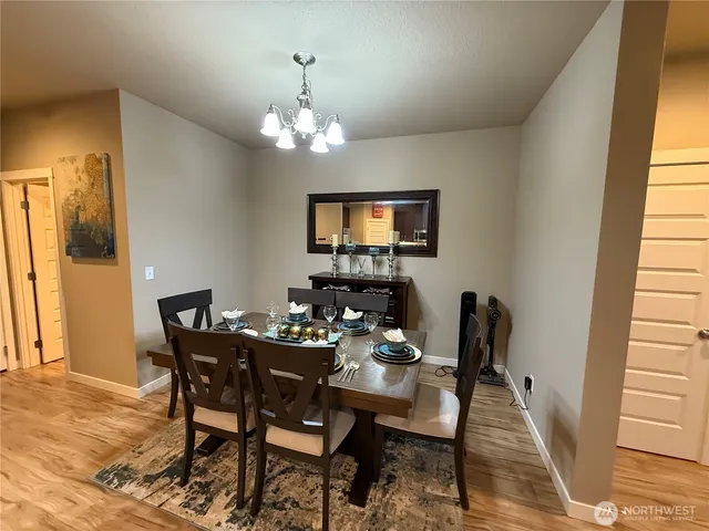 a kitchen with a dining table and chairs